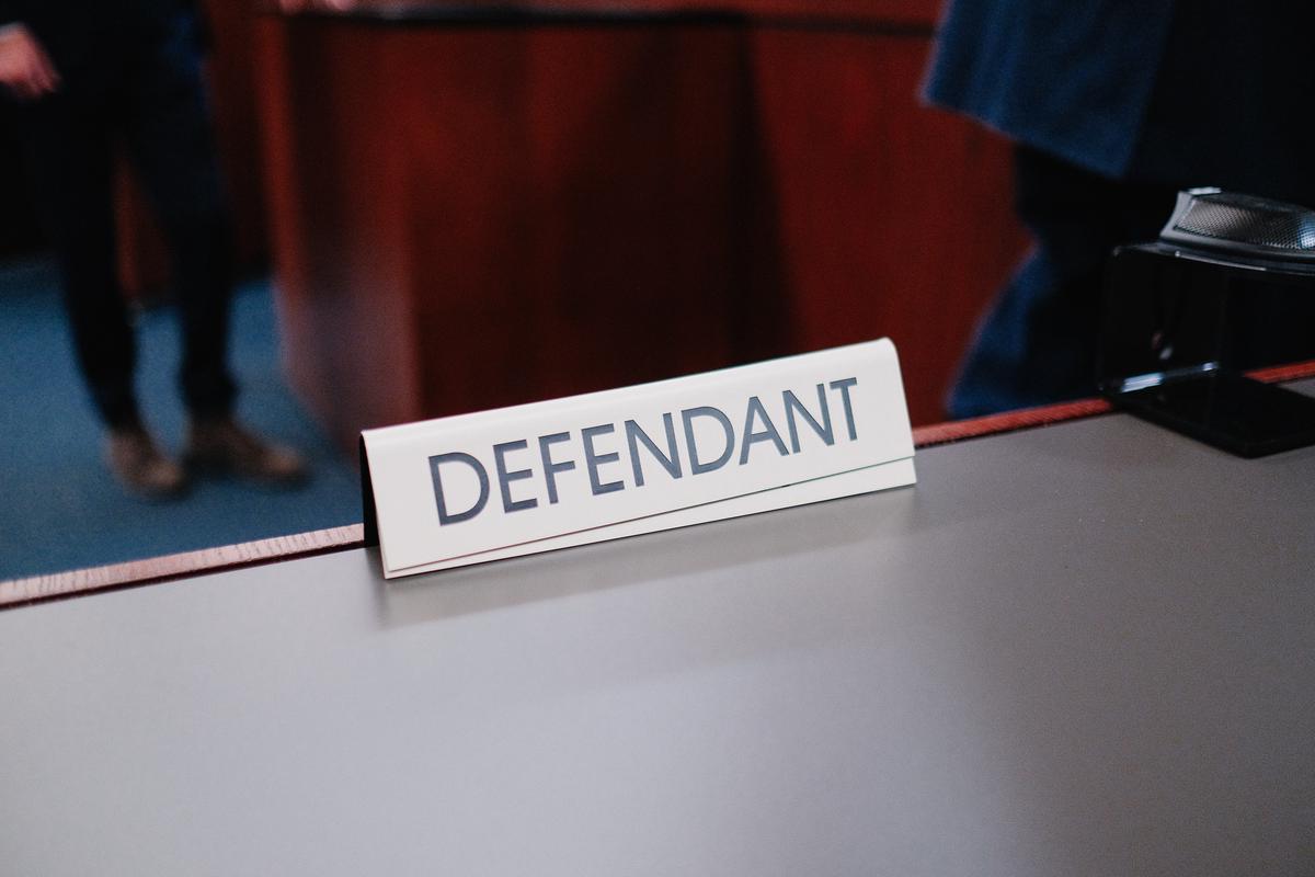 Image showing a public defender in a courtroom, representing underprivileged clients.